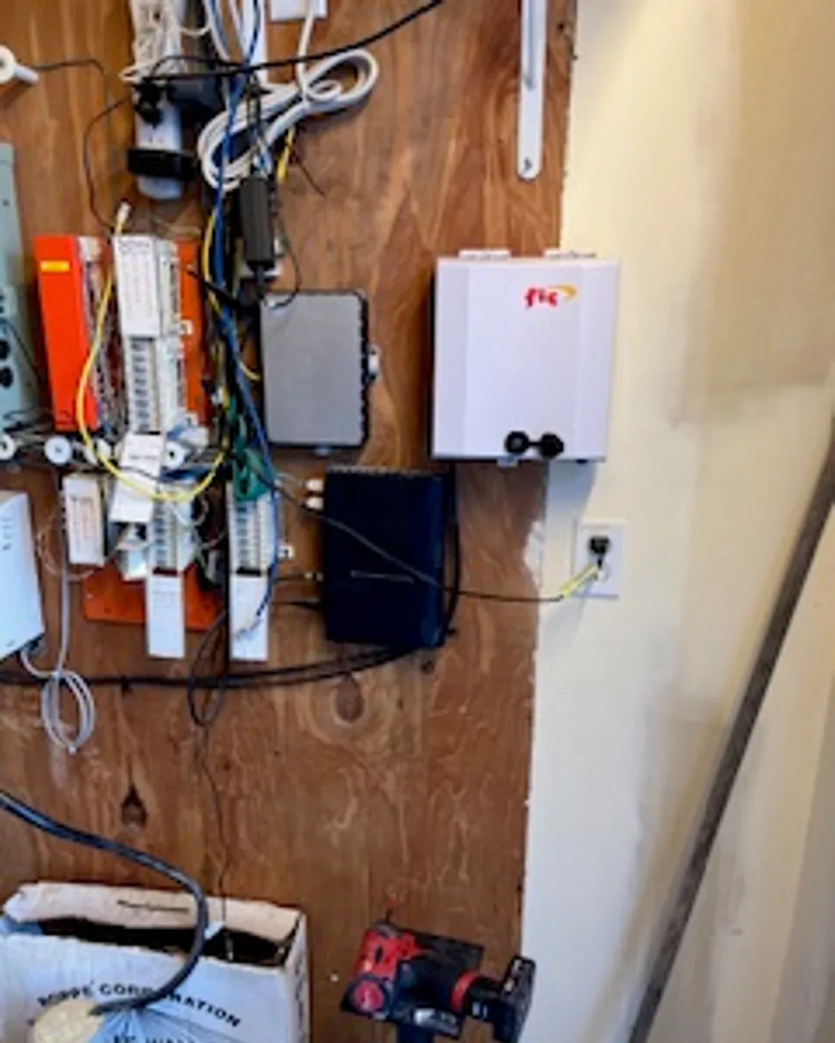 2Brothers Wireless telecom and network equipment mounted on a plywood service board